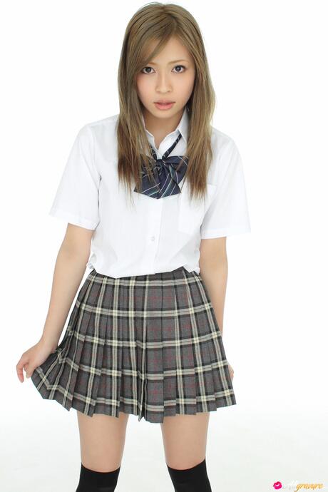 Hot schoolgirl Yuuri Shiina strips her plaid dress and shows her pussy