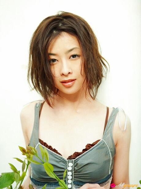 Ponytailed Japanese babe Miho Sugiura strips and shows her hot body